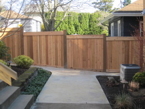 Full Panel Cedar Top Stepped Bottom to Grade Fence