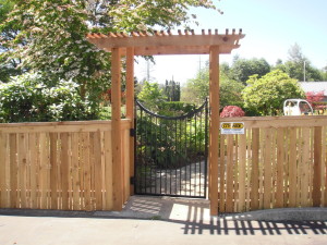 Traditional Cedar Fence with Cedar Arbor and Iron Gate