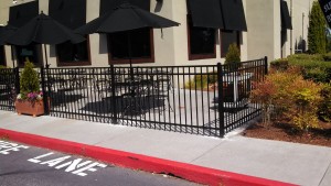 Versa Flat Top Iron Fence around outdoor restaurant patio